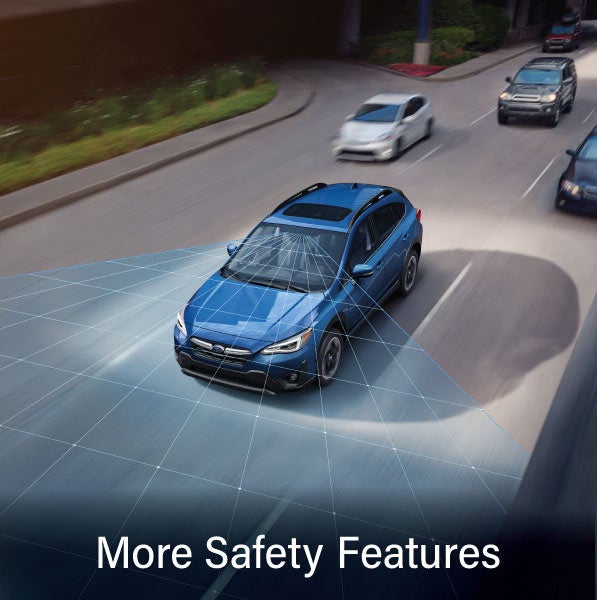 A Subaru Crosstrek in blue with the words “More Safety Features“. | Vann York Subaru in Asheboro NC