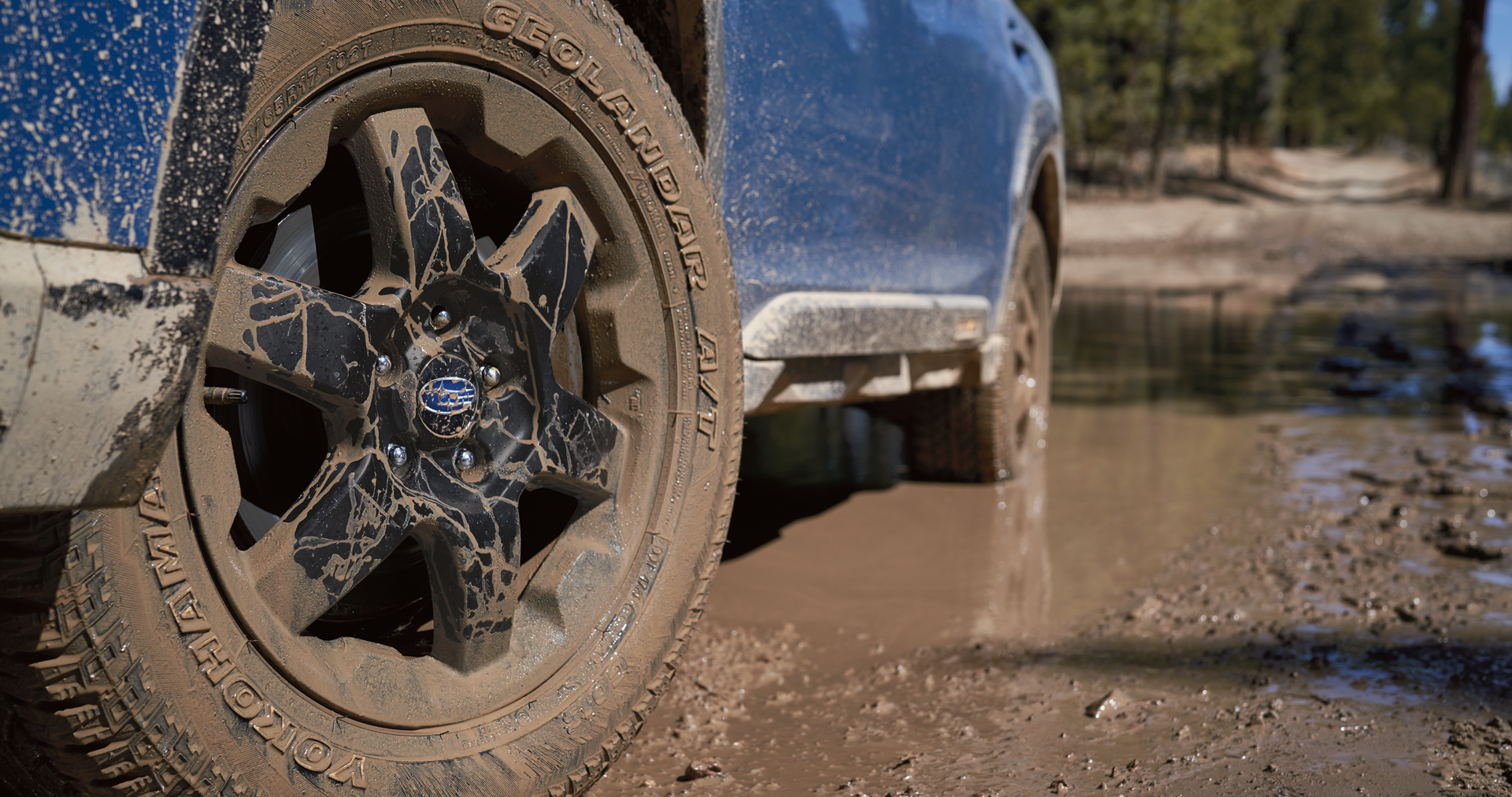 A close-up of the 17-inch off-road wheels and all-terrain Yokohama GEOLANDAR® tires on the 2023 Outback Wilderness. | Vann York Subaru in Asheboro NC